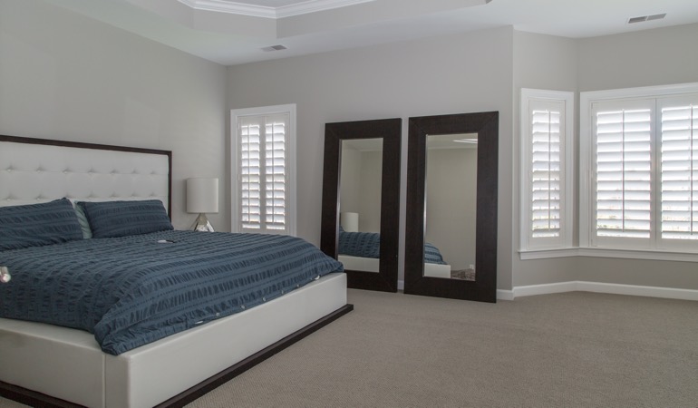 Polywood shutters in a minimalist bedroom in Jacksonville.